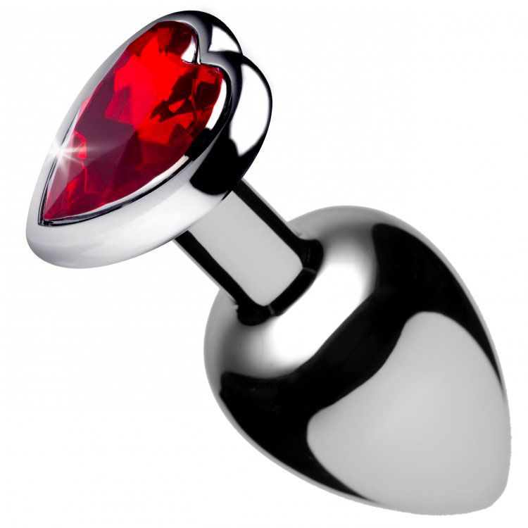 Polished metal butt plug with red heart-shaped jewel base, designed for elegant anal play and visual appeal during wear